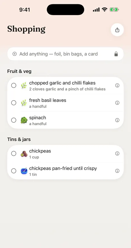 The shopping list in Just Add, grouped by aisle: garlic and chilli flakes, fresh basil and spinach under fruit and veg, then chickpeas under tins and jars.